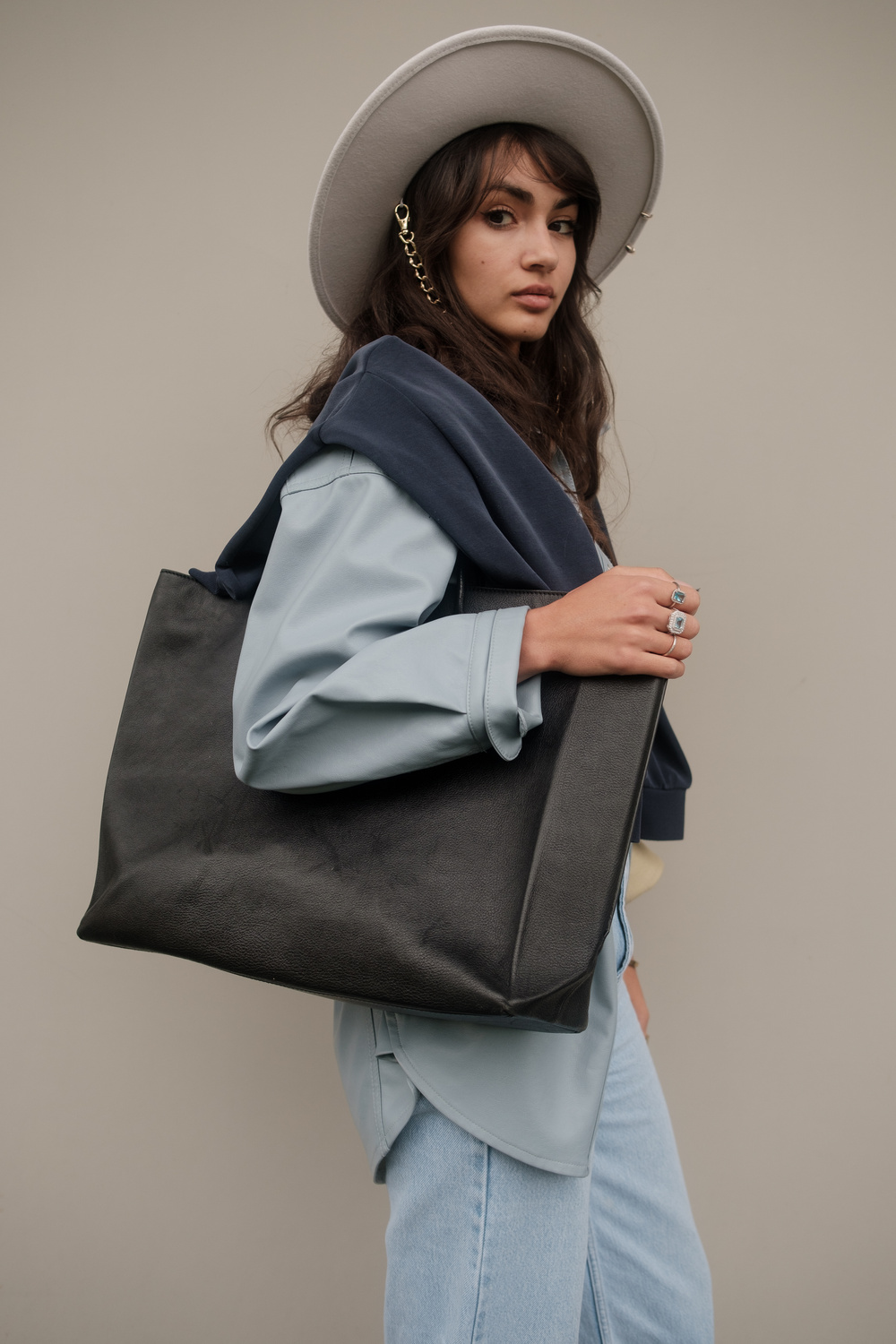 Girl Wearing Hat and Oversized Bag 