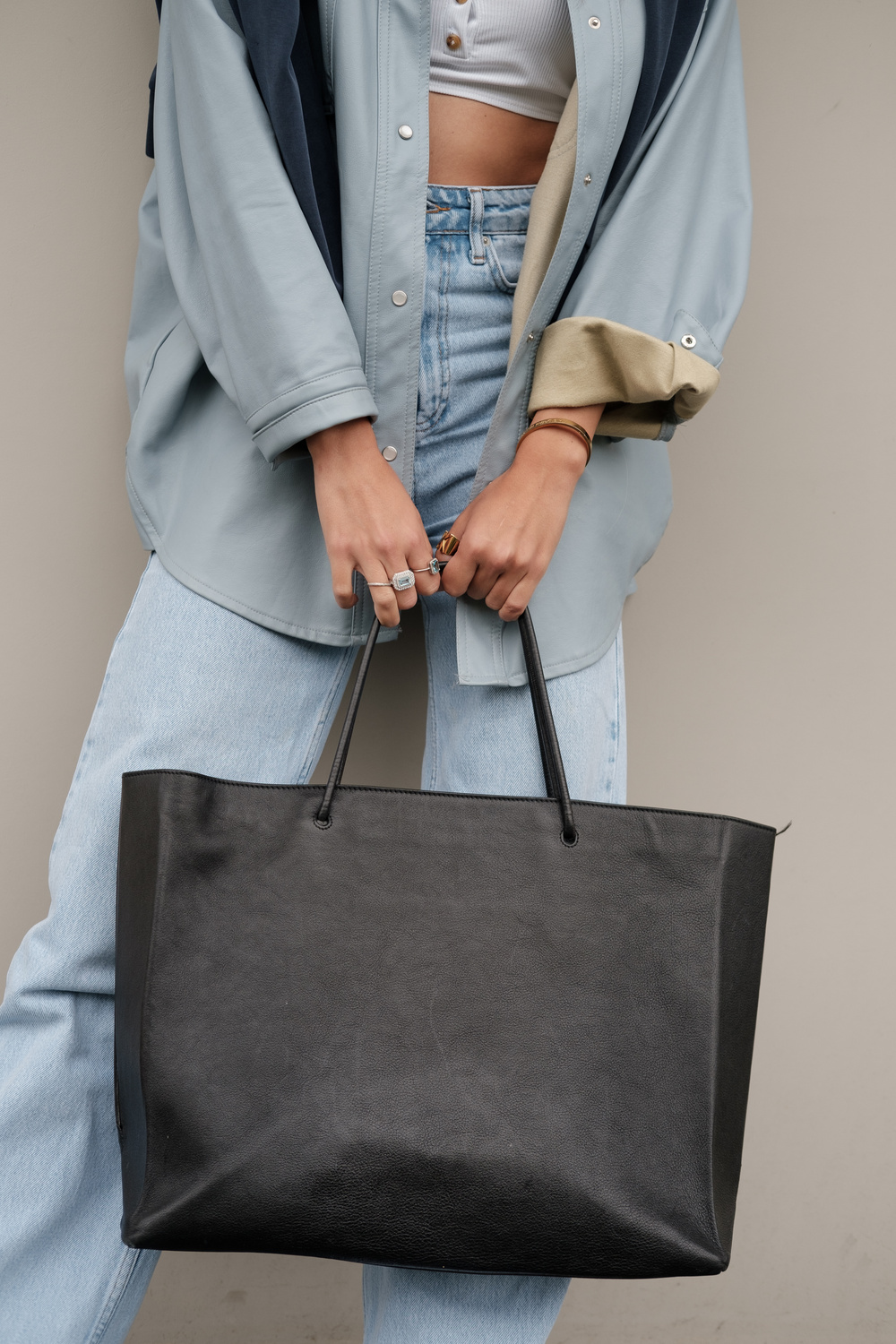 Midsection of a Woman with Black Bag 